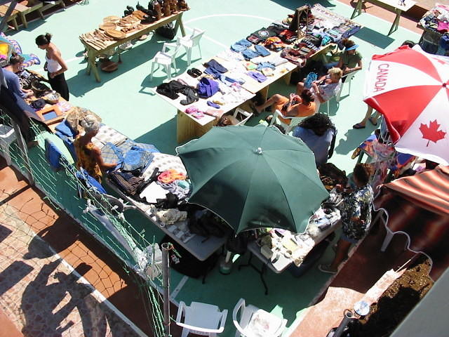 Another ariel with vendors using their brollies to keep off the sun