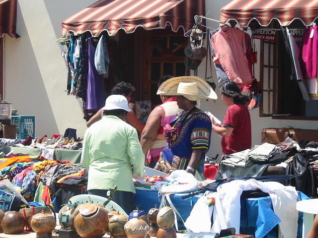 Elaine with her baggy trousers & tote bags in real Jamaican colours