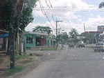 1 km further, at the stop light go straight. You will see the first sign to roaring river. By the Esso Station.