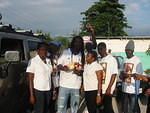 Posing with Love Boat staff & his crew outside Daley's Liquor Store in the West End
