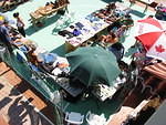 Another ariel with vendors using their brollies to keep off the sun