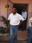 Kofi Asante, President of the Negril Rotary Club helps at the party, his children attend the school too