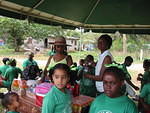 Refreshments & shade, very important in this hot climate. Parents give a hand